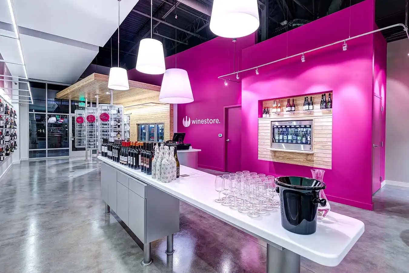 Winestore lobby with wine bottles on tables and shelves for sale