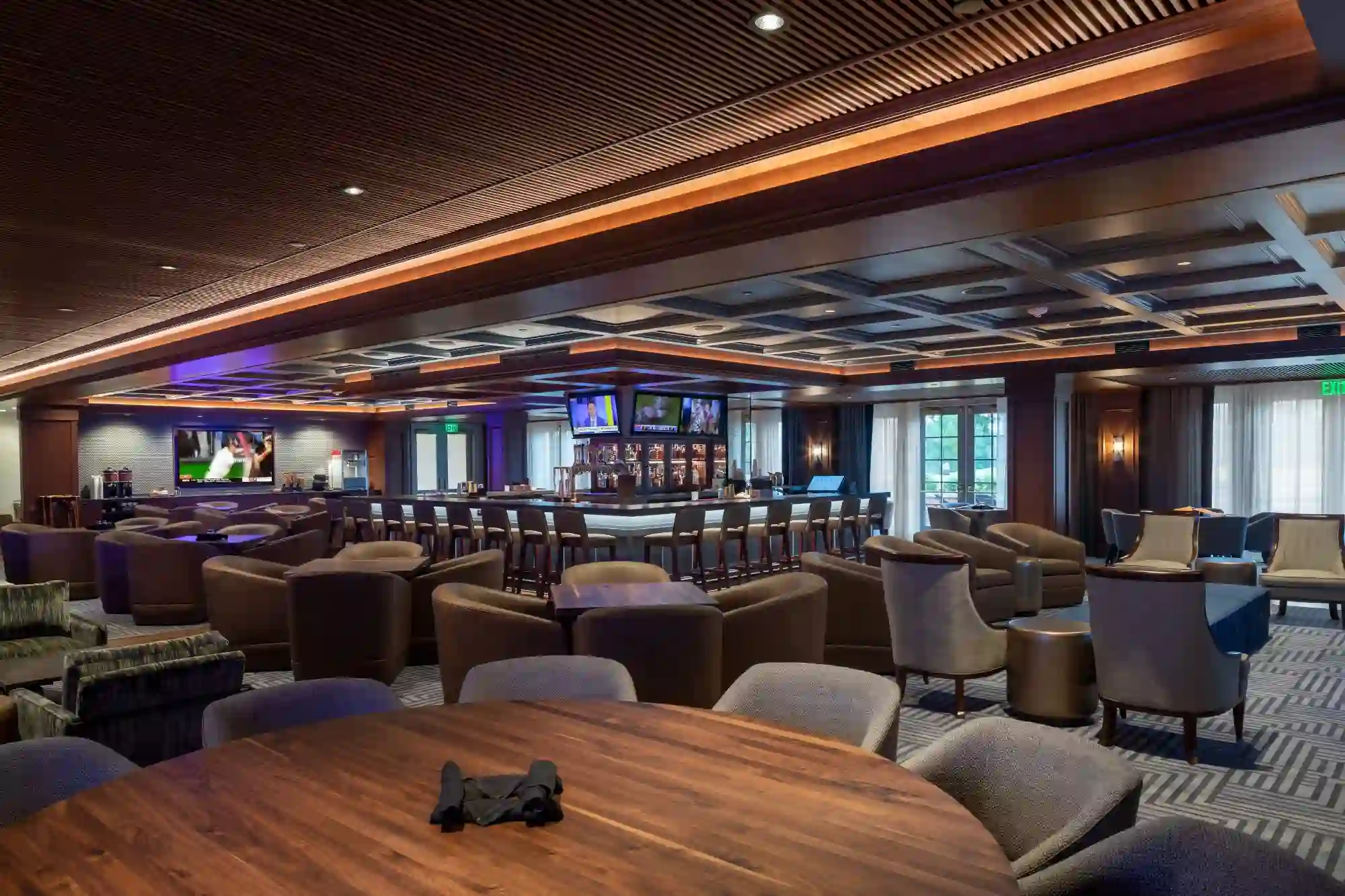 Carmel Country Club lounge with table and bar seating