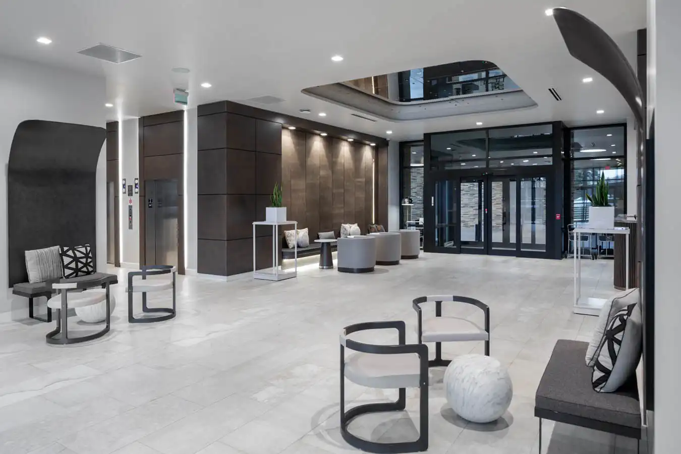 A building lobby with a black, white, and brown aesthetic