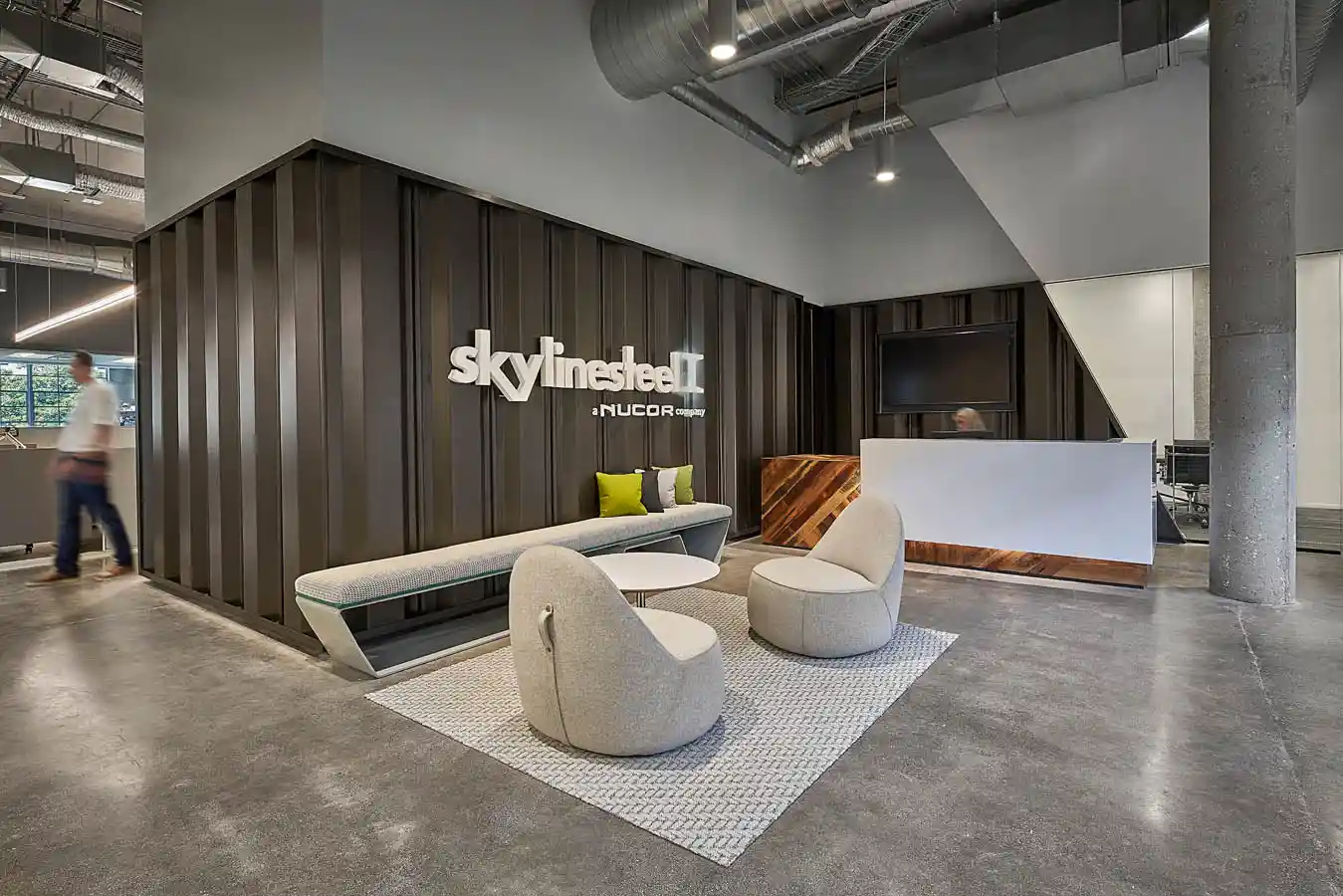 Skylines Steel lobby with seating in front of a reception desk